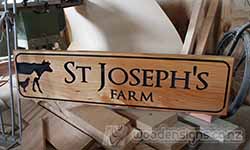 macrocarpa timber sign carved wooden cow sheep and chicken